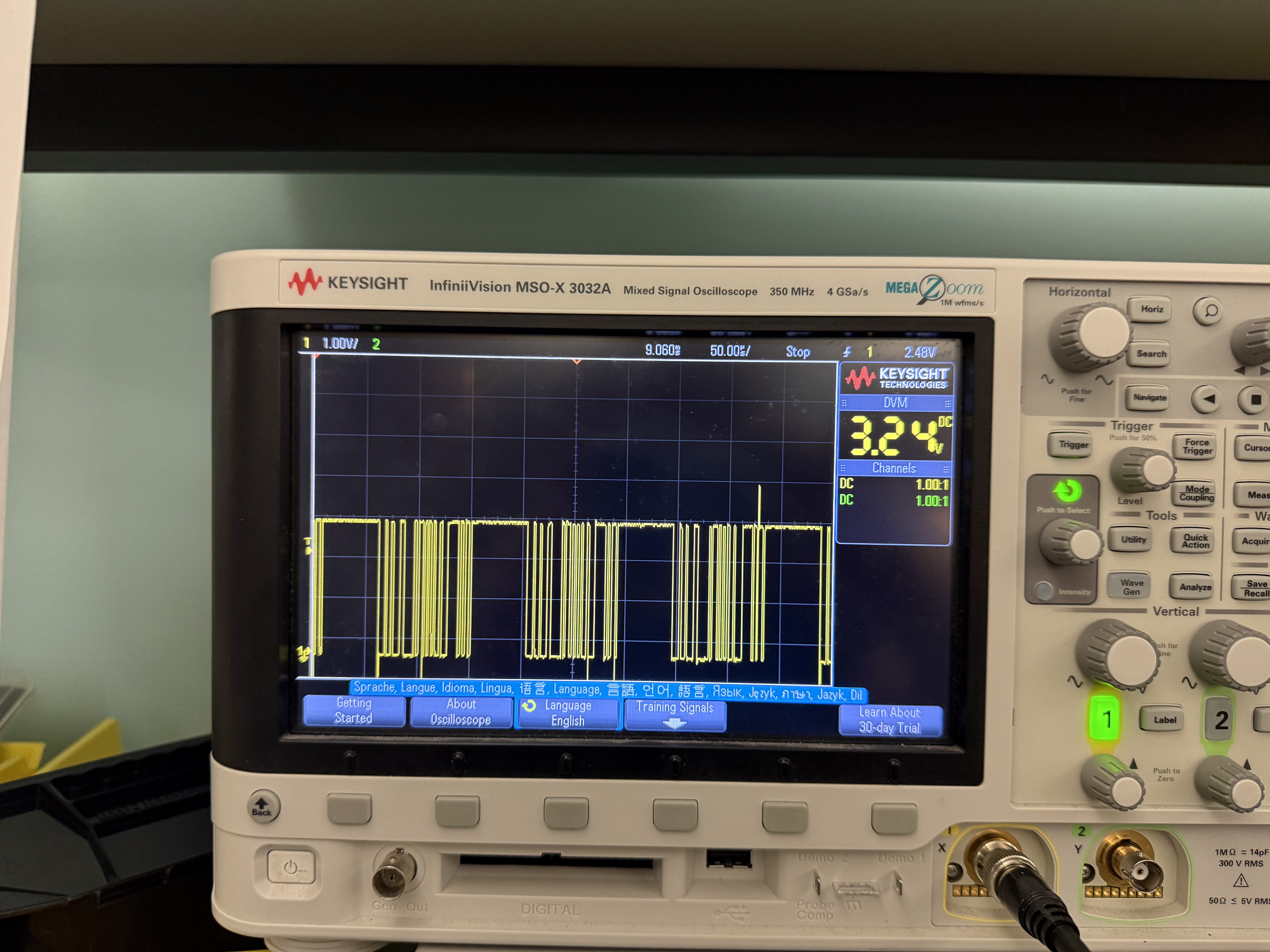 Oscilloscope display showing binary data 
